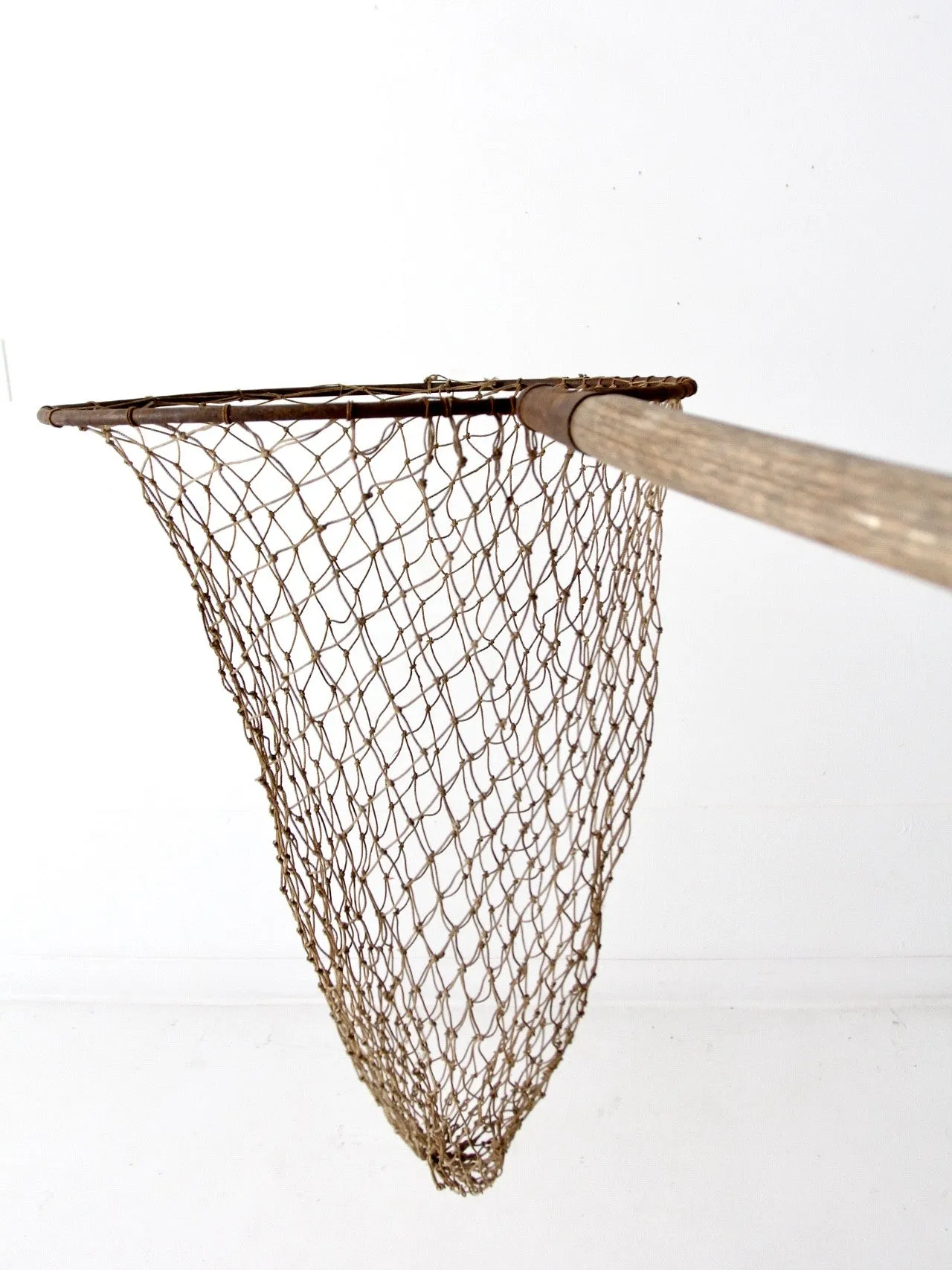 antique fish net on pole