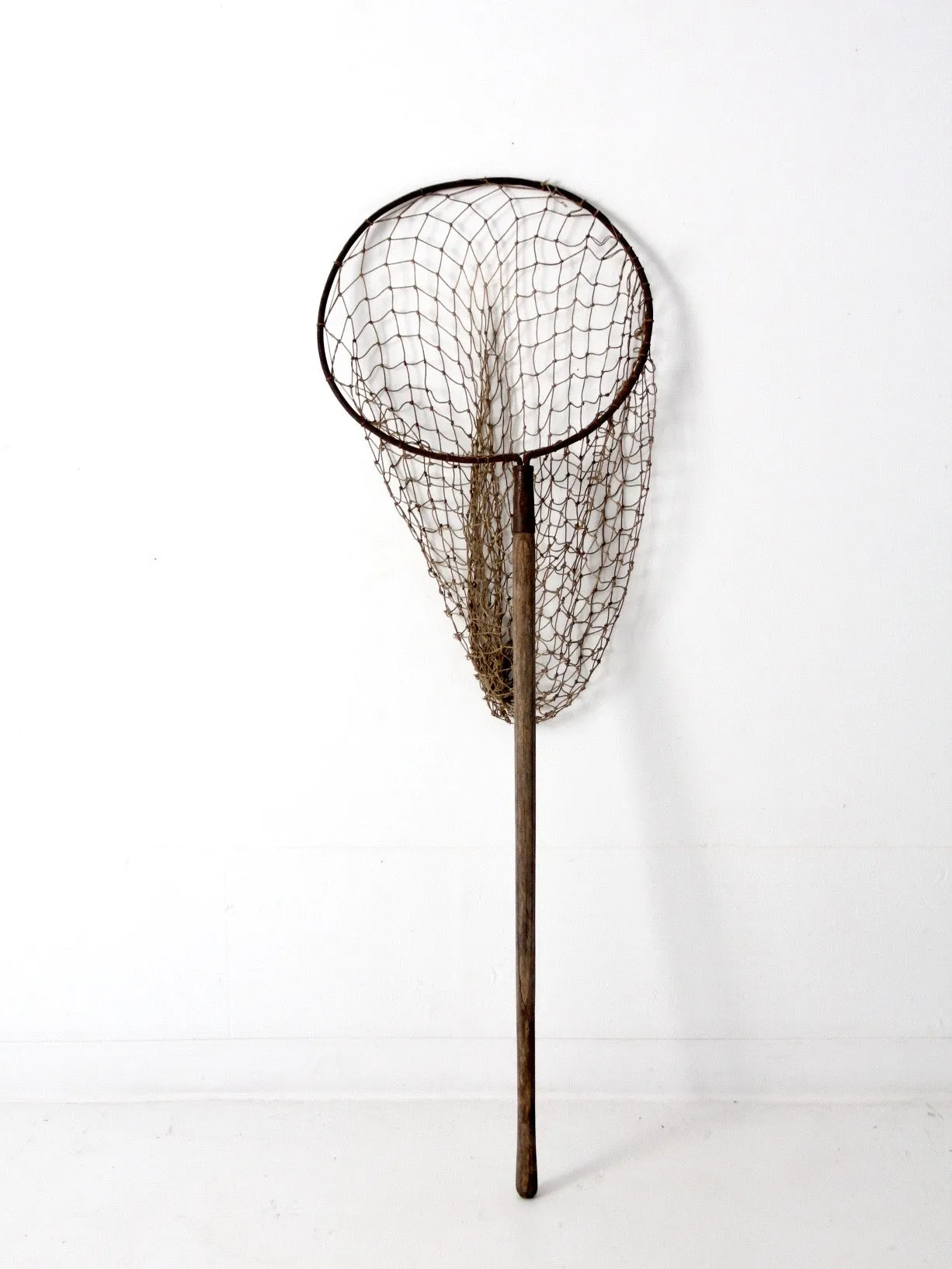 antique fish net on pole